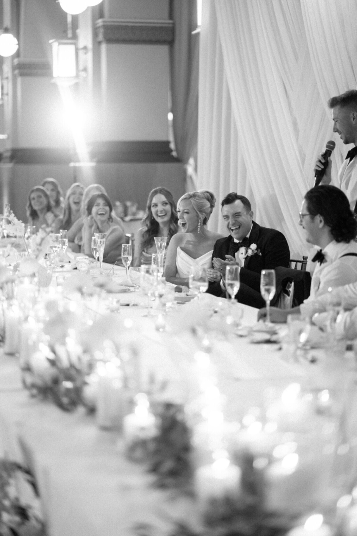 Bridal party sitting at table in reception taken by chicago wedding photographer Allison Francois