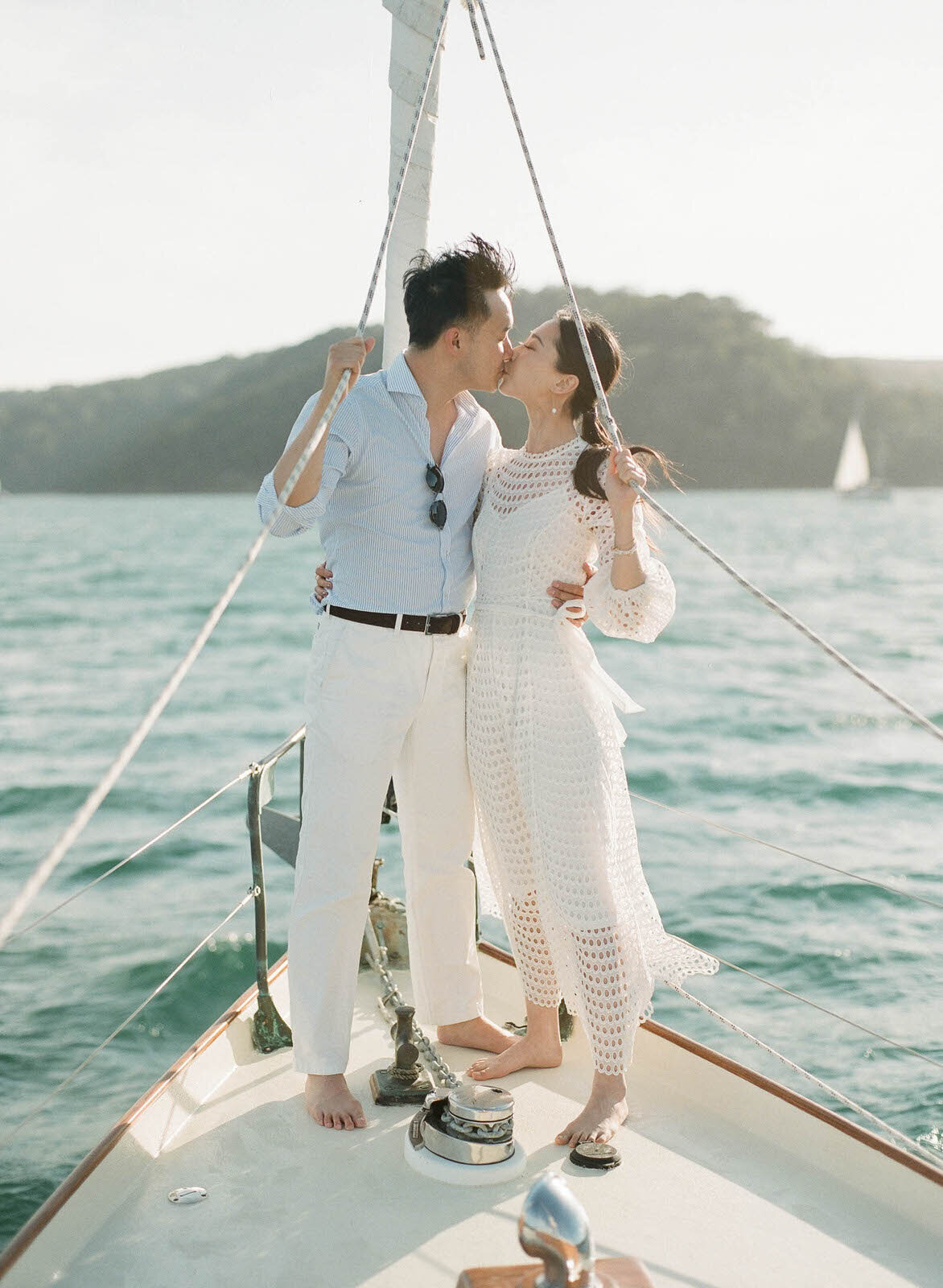 engaged couple riding a boat in Palm Beach, Sydney