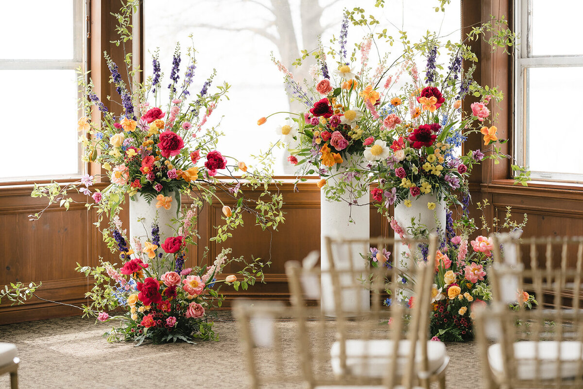 coulorful-wedding-ceremony-flowers-forest-stream-club