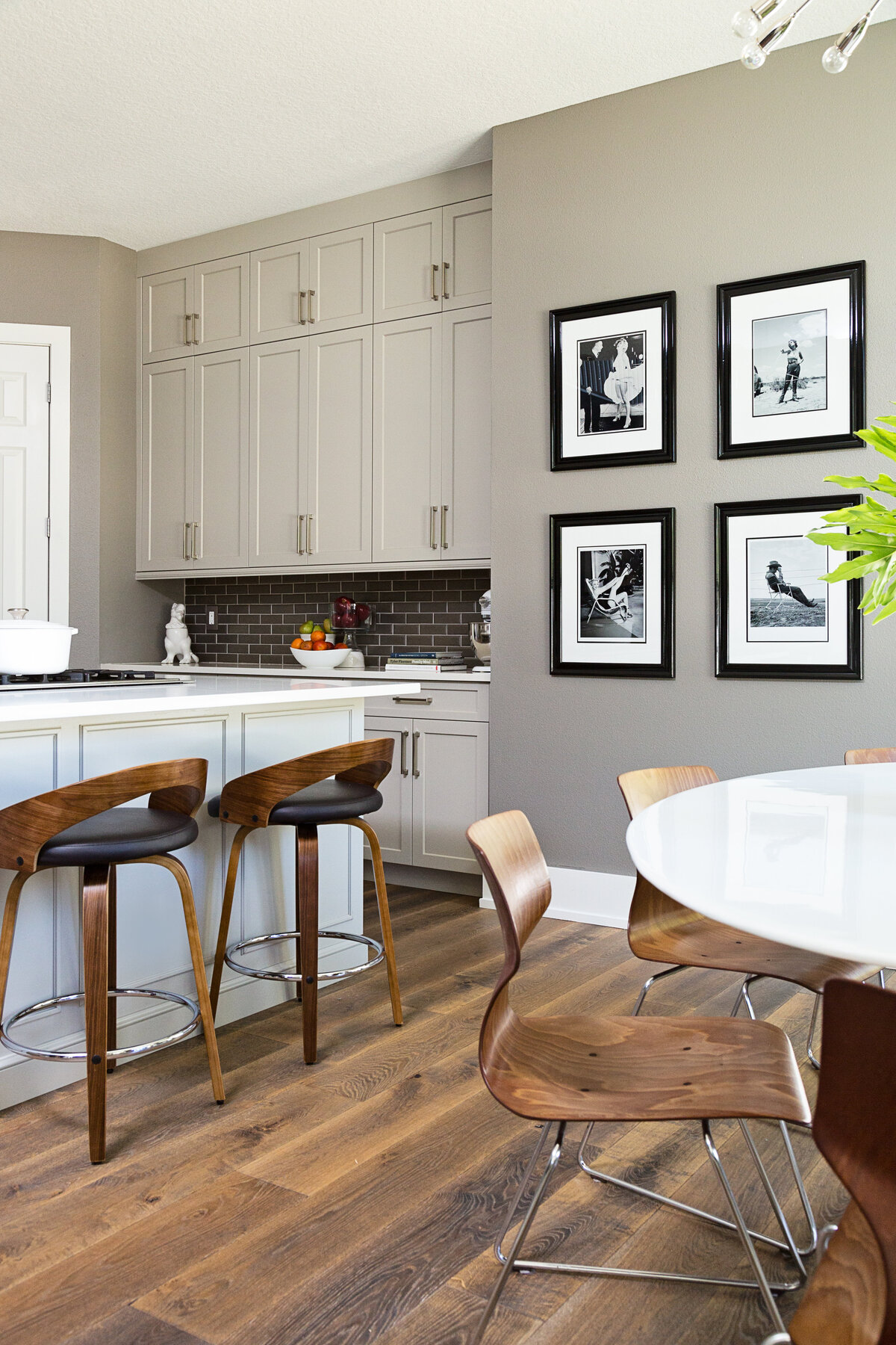 Kitchen Dining Area with a Round White Table and Brown Chairs