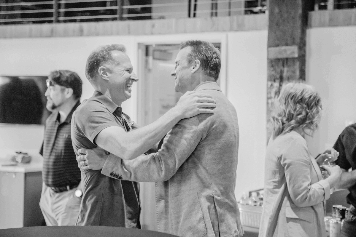 Laptop screen showing Lon Stroschein welcoming members to The Insider, a private Normal 40 community hosted on Circle