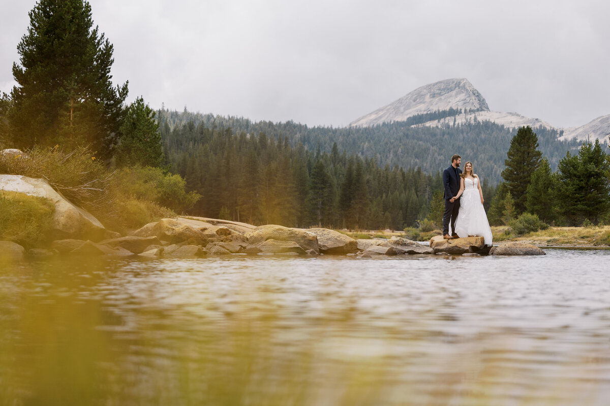 couple wearing hiking boots and fancy clothes