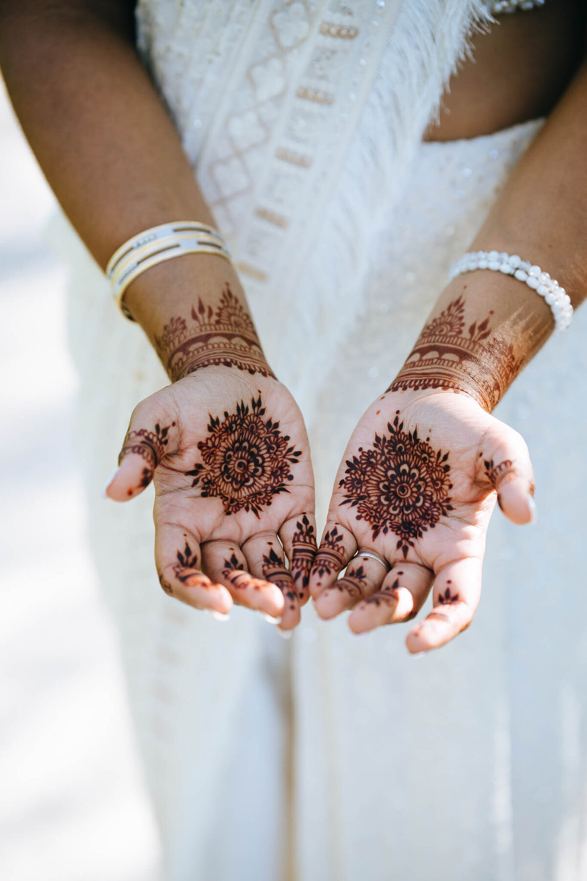 close up of henna on brides hands