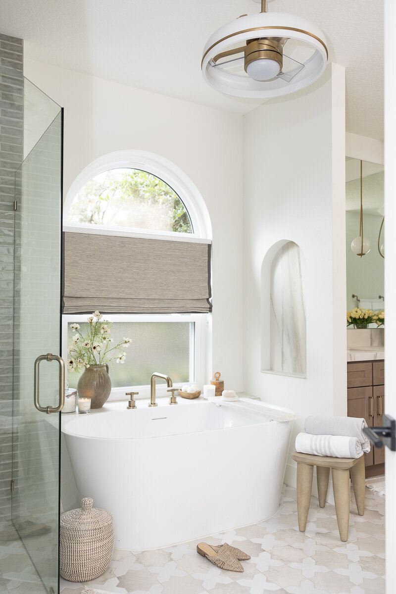 dewine design orlando interior designer belle isle bathroom with standing rub and arched window