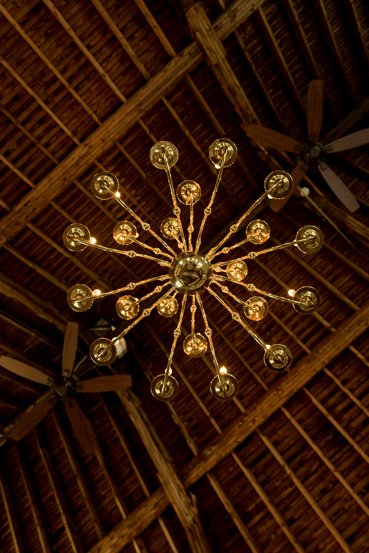 chandelier in rustic barn venue for wedding