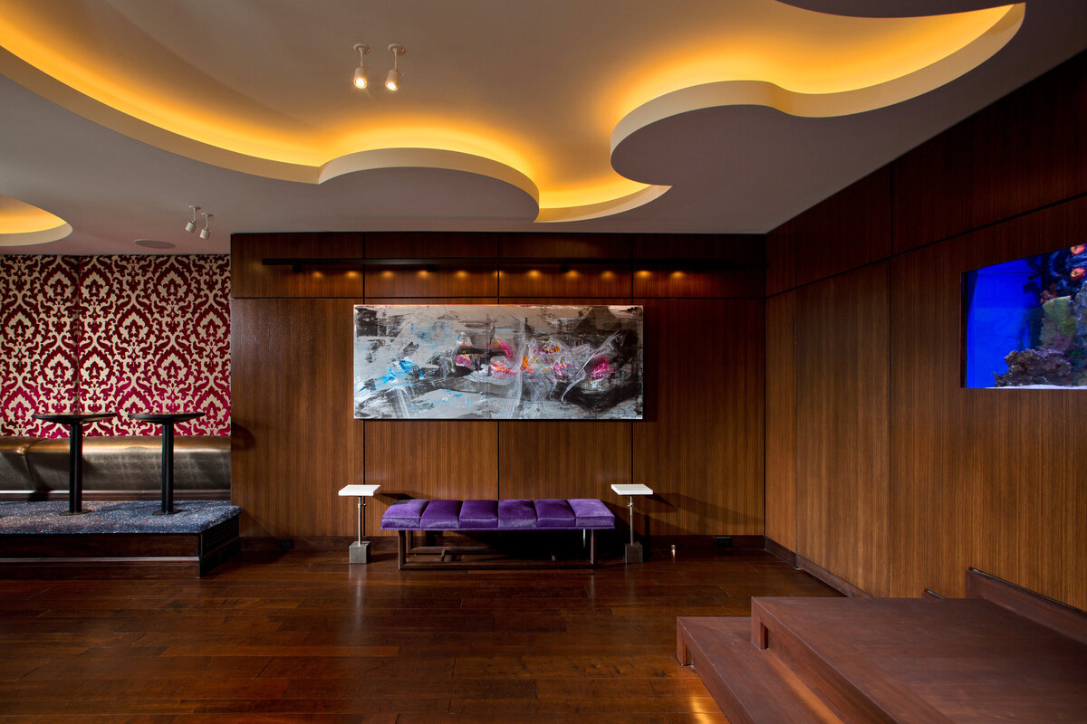 seating area with dark wood paneled wall