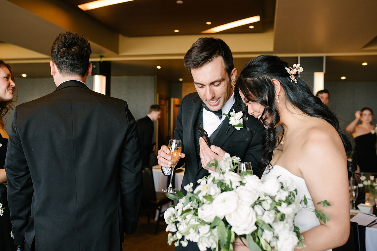 Candid wedding portrait of a couple in downtown Denver, taken by a documentary wedding photographer.