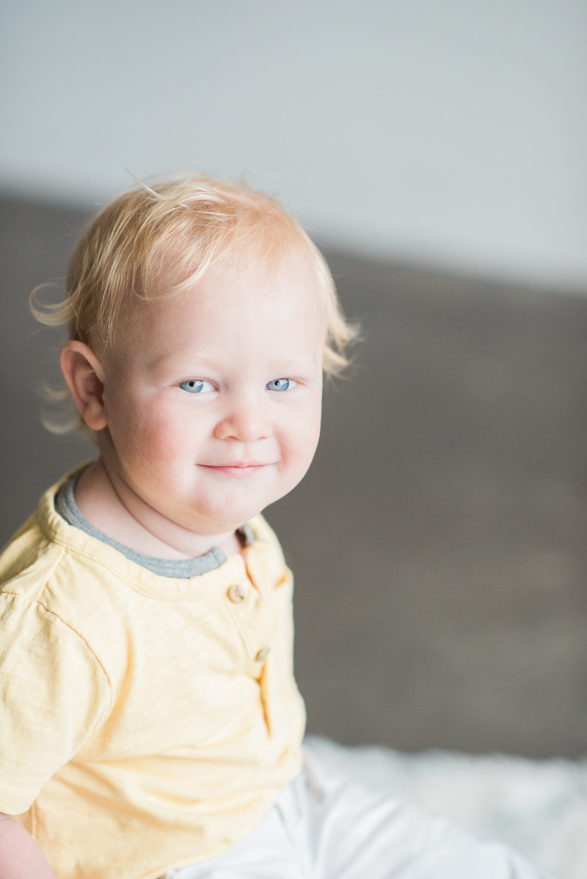 toddler boy portrait in a yellow shirt