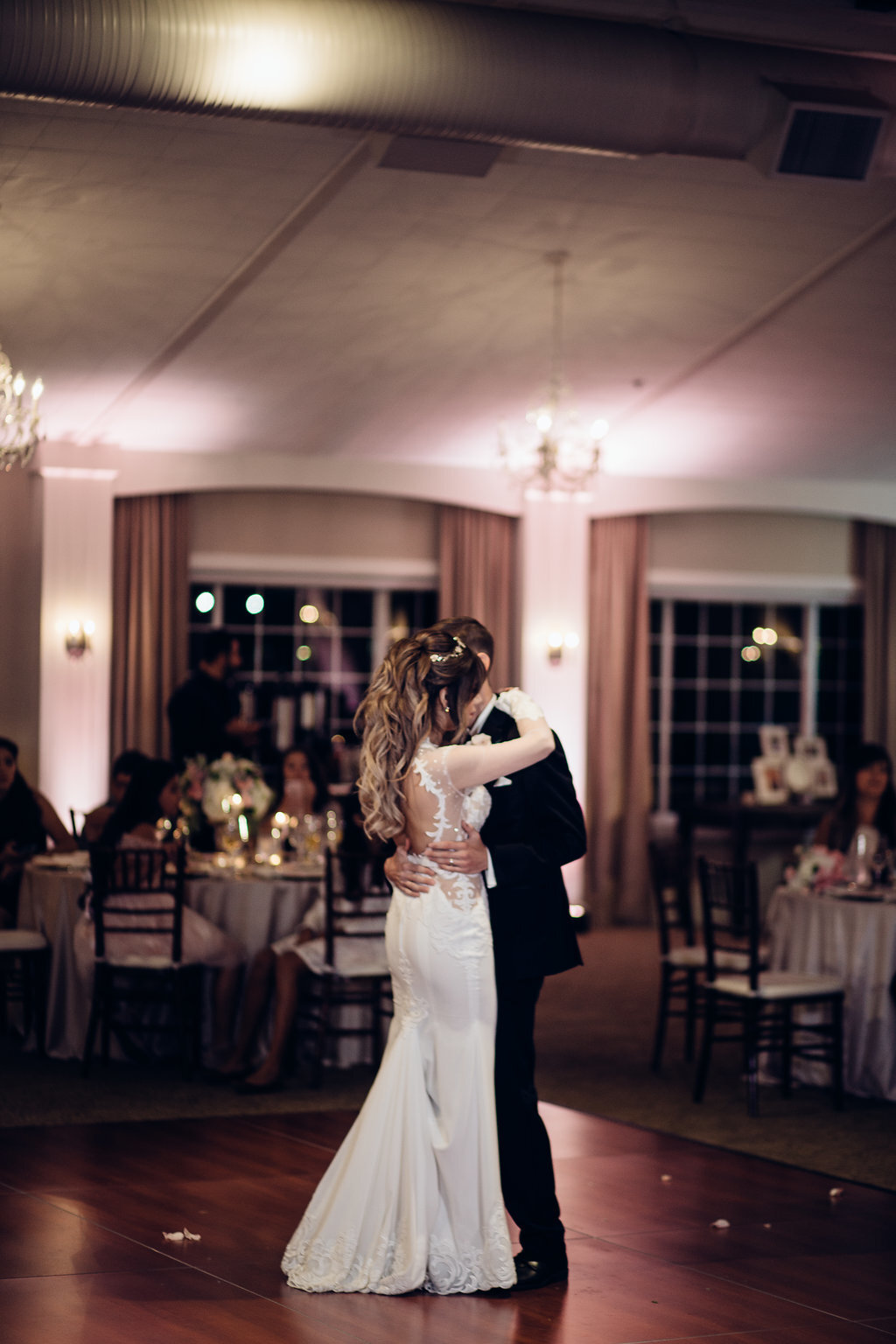Wedding Photograph Of Bride And Groom Holding Each Other While Dancing Los Angeles
