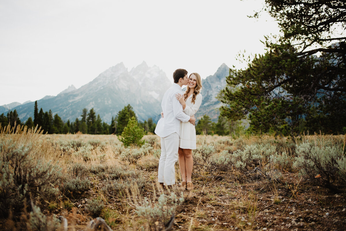 Photographers Jackson Hole capture man kissing woman's cheek