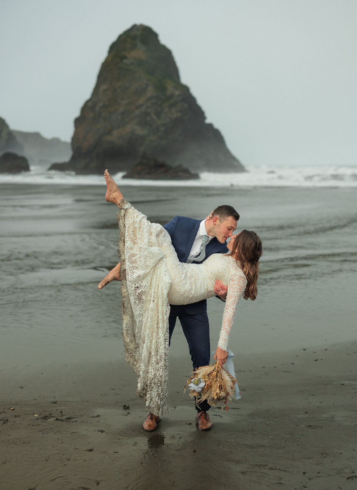 A romantic elopement photo taken on the rugged Oregon coast, showcasing Kollar Photography's signature style. Arizona elopement photographer capturing intimate moments across stunning destinations.