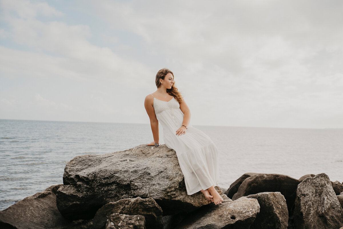 Capture the essence of your senior year with a stunning beach photoshoot in Milford, CT. With the ocean breeze, natural rock formations, and soft coastal light, this session creates timeless, ethereal portraits. Book your high school senior photography session today to celebrate this milestone with breathtaking coastal scenery!