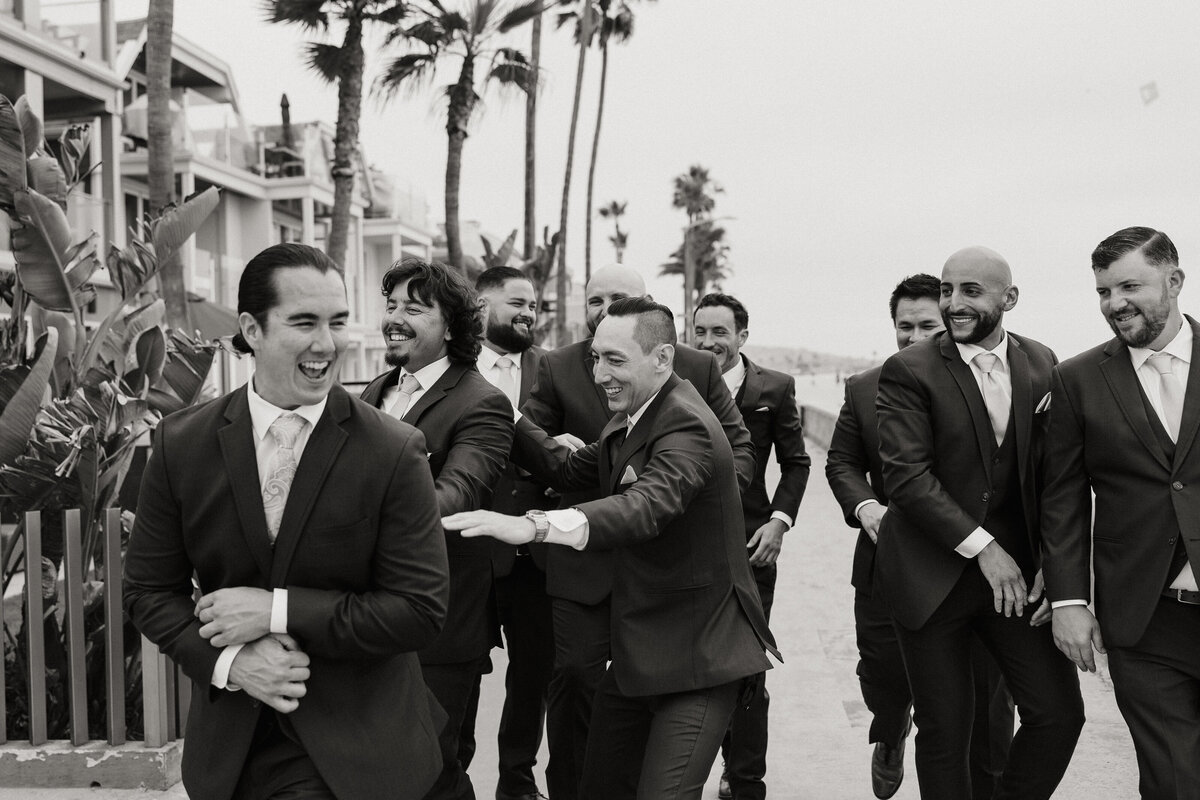 mission bay beach session, groomsmen photos, groom laughing with groomsmen, belmont park wedding 