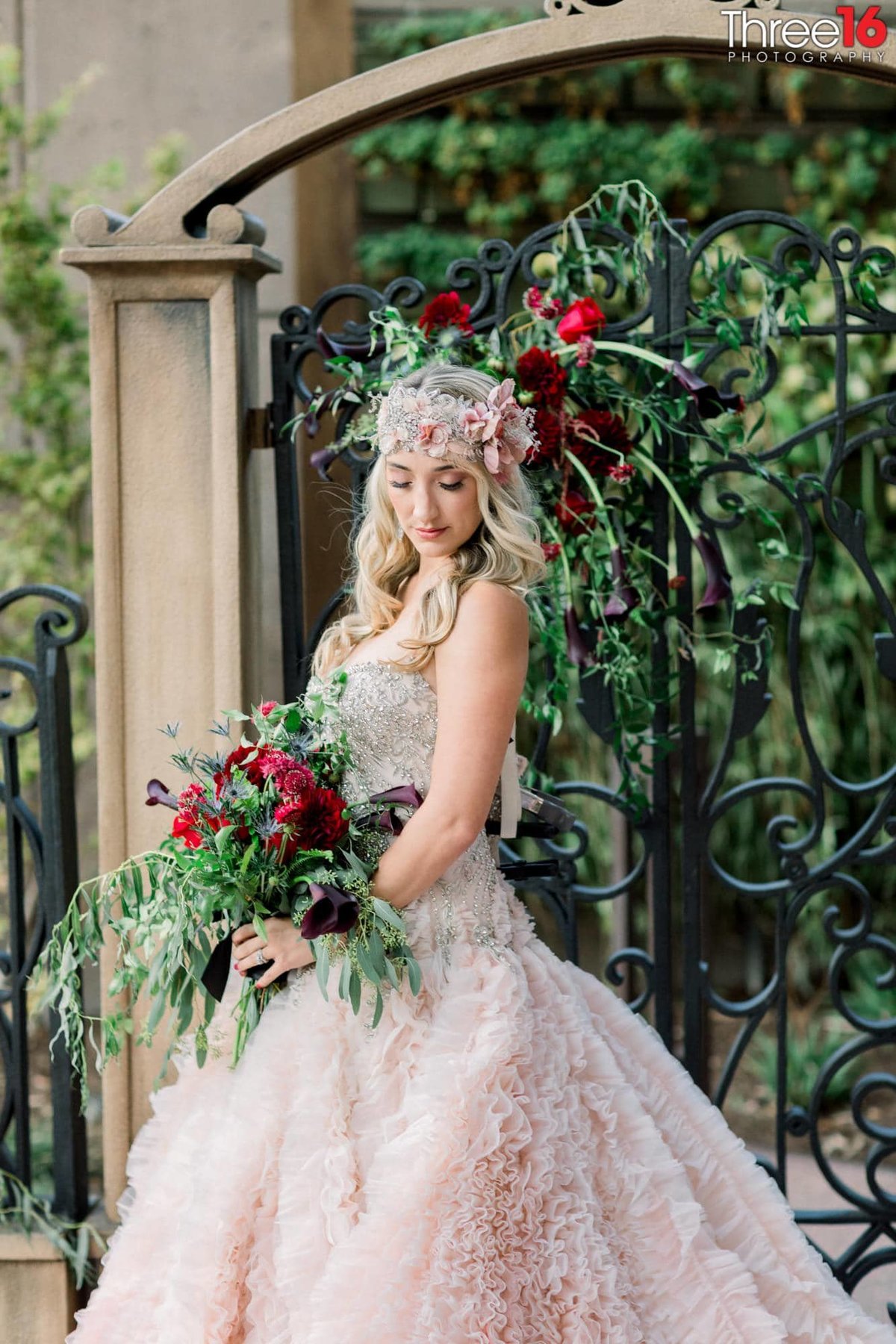 Bride poses for photos with her beautiful bouquet
