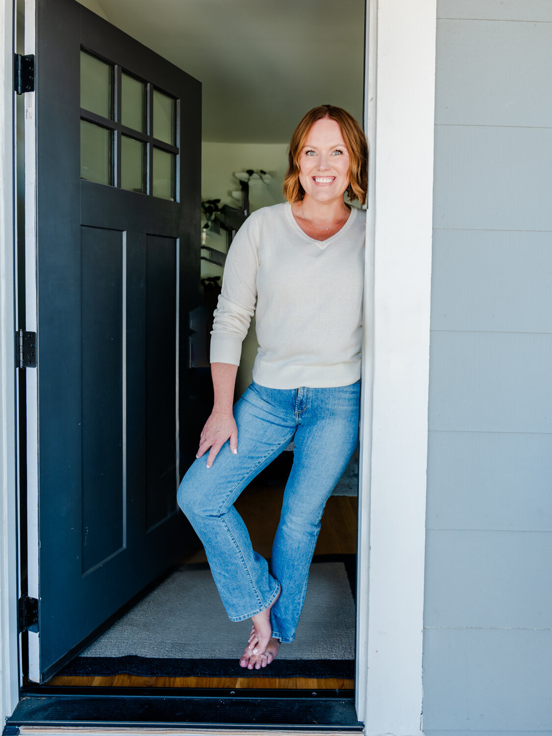 Courtney Murphy in the front door entrance of her home