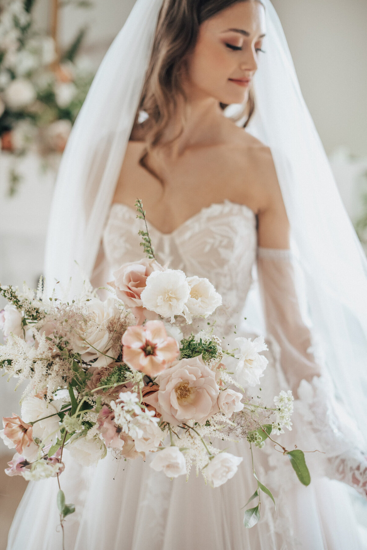 Gorgeous pink and white bridal bouquet by Calyx Floral Design, an innovative Red Deer, Alberta wedding florist, featured on the Brontë Bride Vendor Guide.