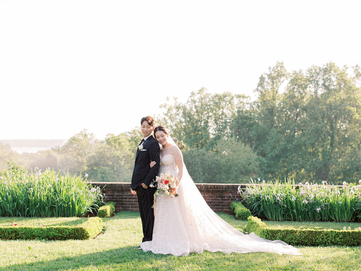 Couple posing together on garden lawn