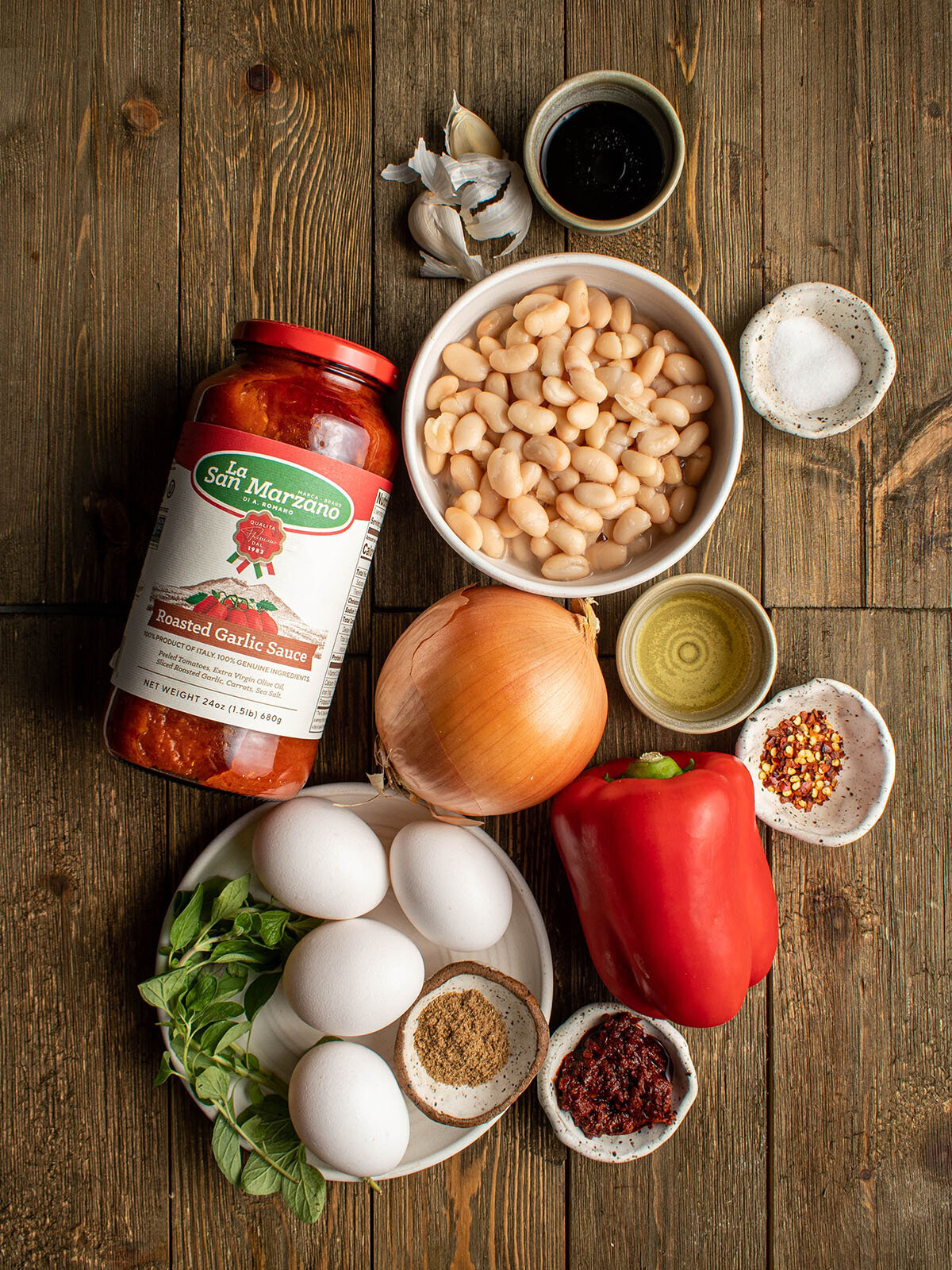 San Marzano roasted garlic sauce product shot with ingredients to make shakshouka