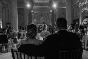 Black and white wedding photography capturing an elegant St Augustine reception in a historic venue with classical columns and arched architecture