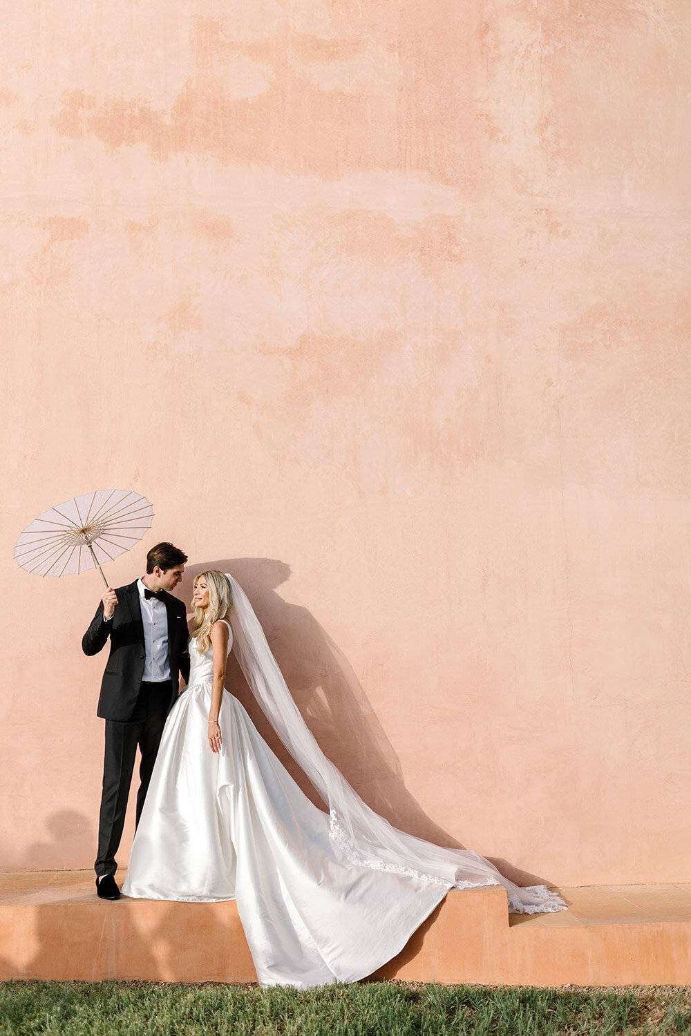 bride and groom photo with paper umbrella