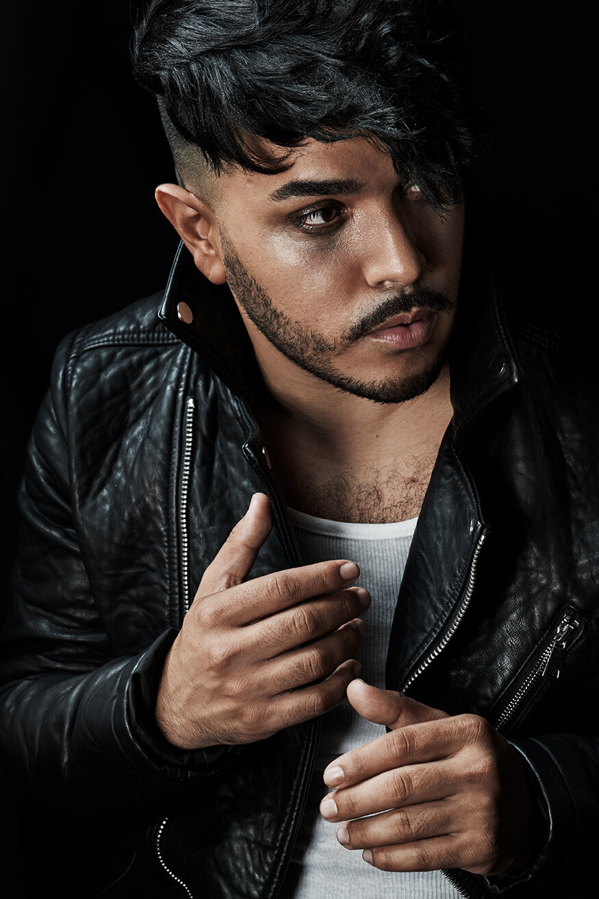 Bold portrait of Mr. B Styles in a reflective jacket, exuding charisma, shot by Ylva Erevall.
