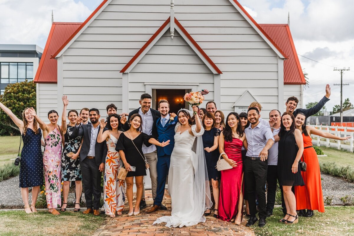 Top-rated marriage celebrant Auckland guiding couple through ceremony in creative venue