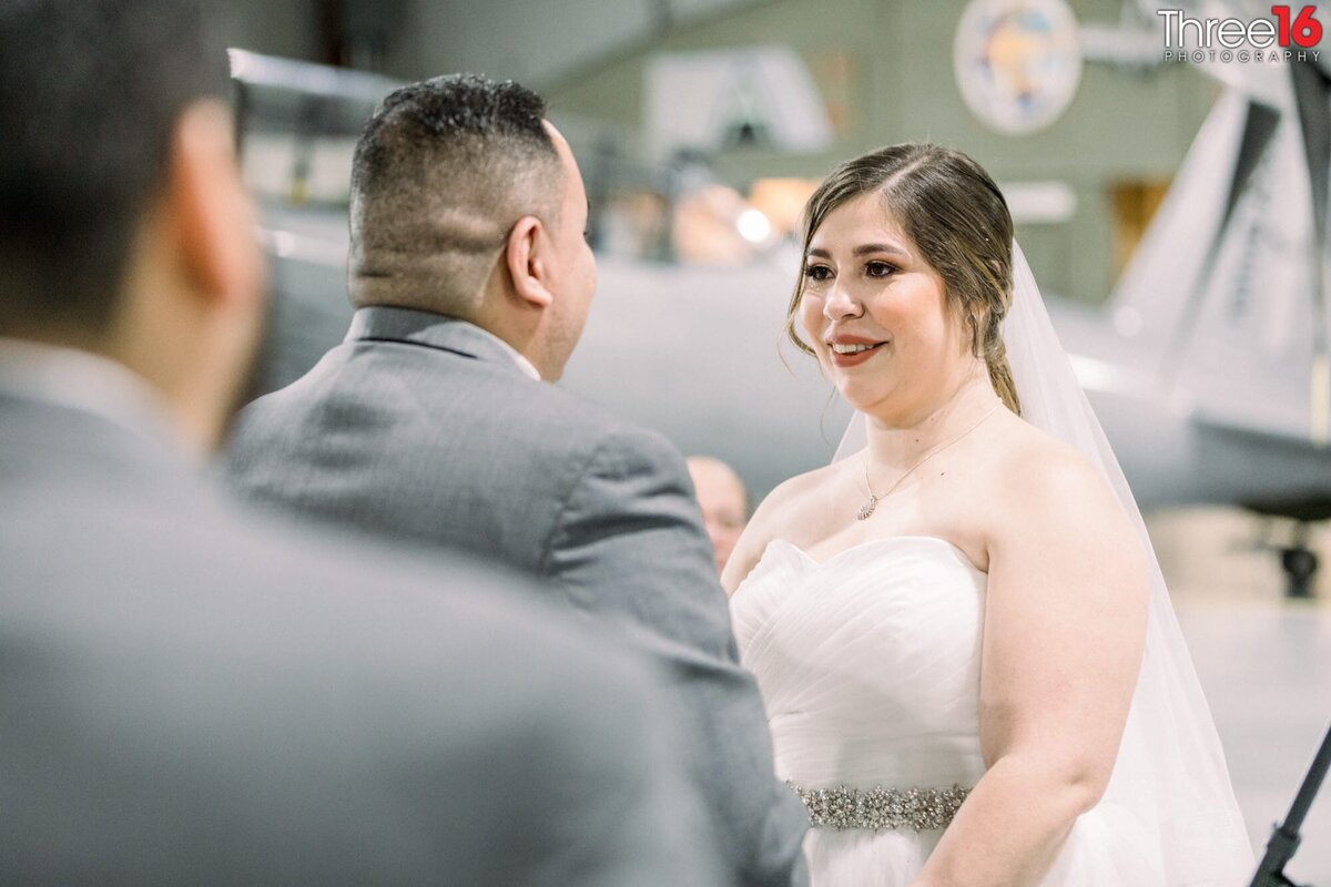 Bride and Groom face each other during the ceremony