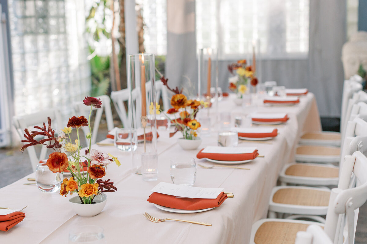 palo alto reception long tables with taper candles and ikebana florals