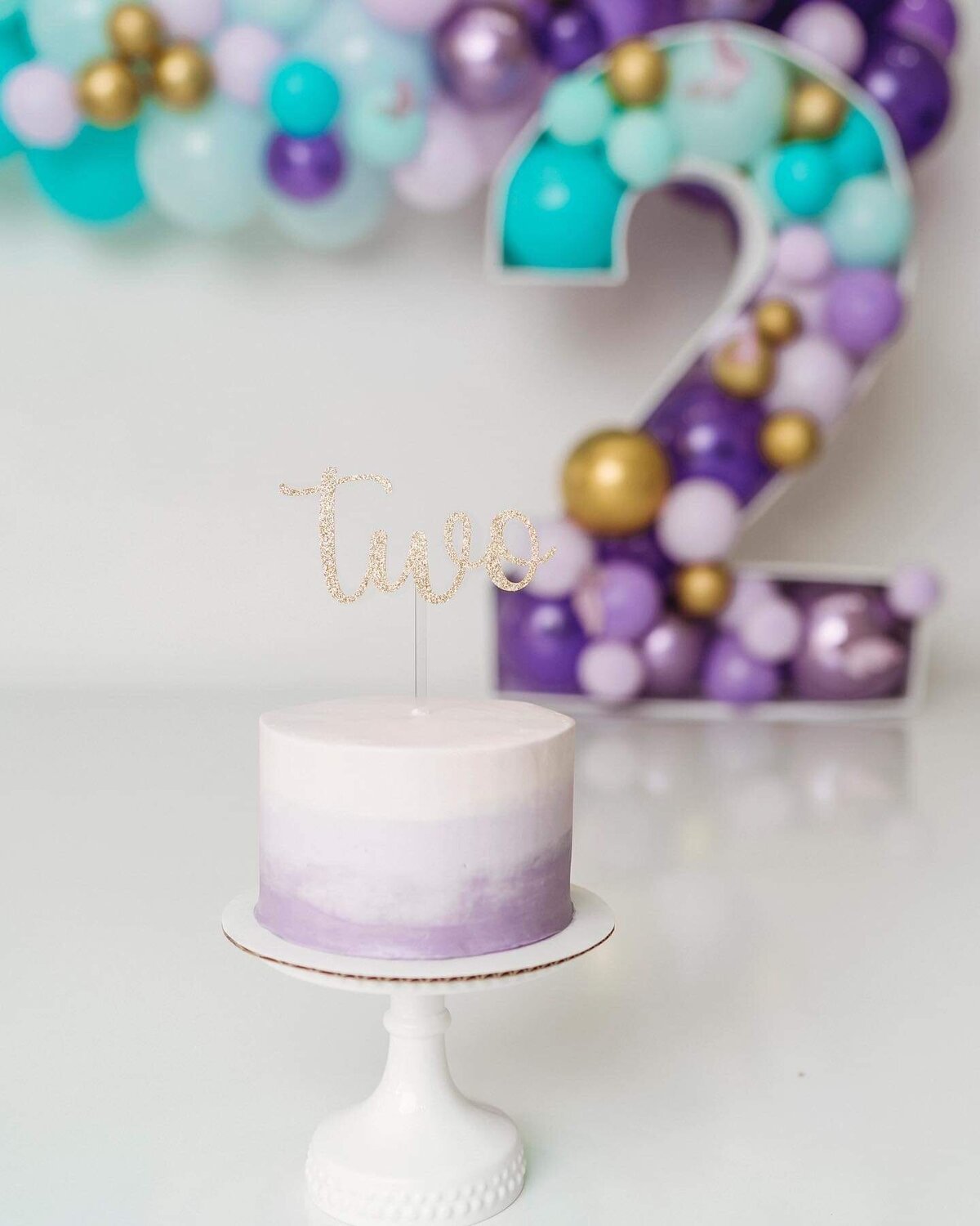 Purple and blue mermaid theme birthday with gold cake topper