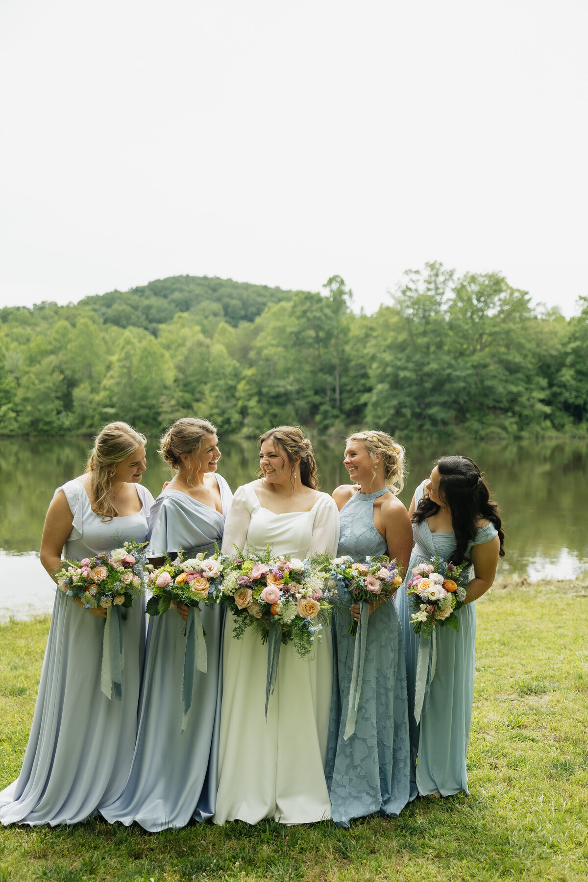 Bride and bridesmaids with colorful bouquets designed by Abby Grace Florals at Dahlonega GA wedding