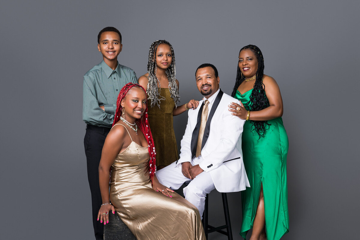 Elegant Family Portrait in Formal Attire with a Modern Backdrop-33