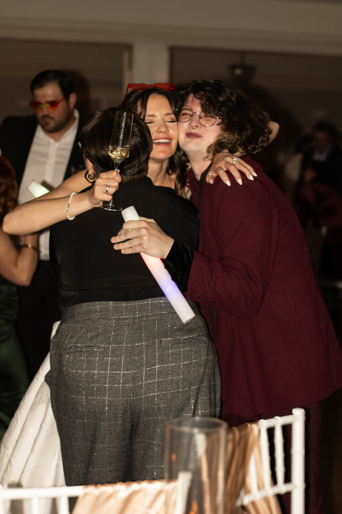 bride hugging guest candid 