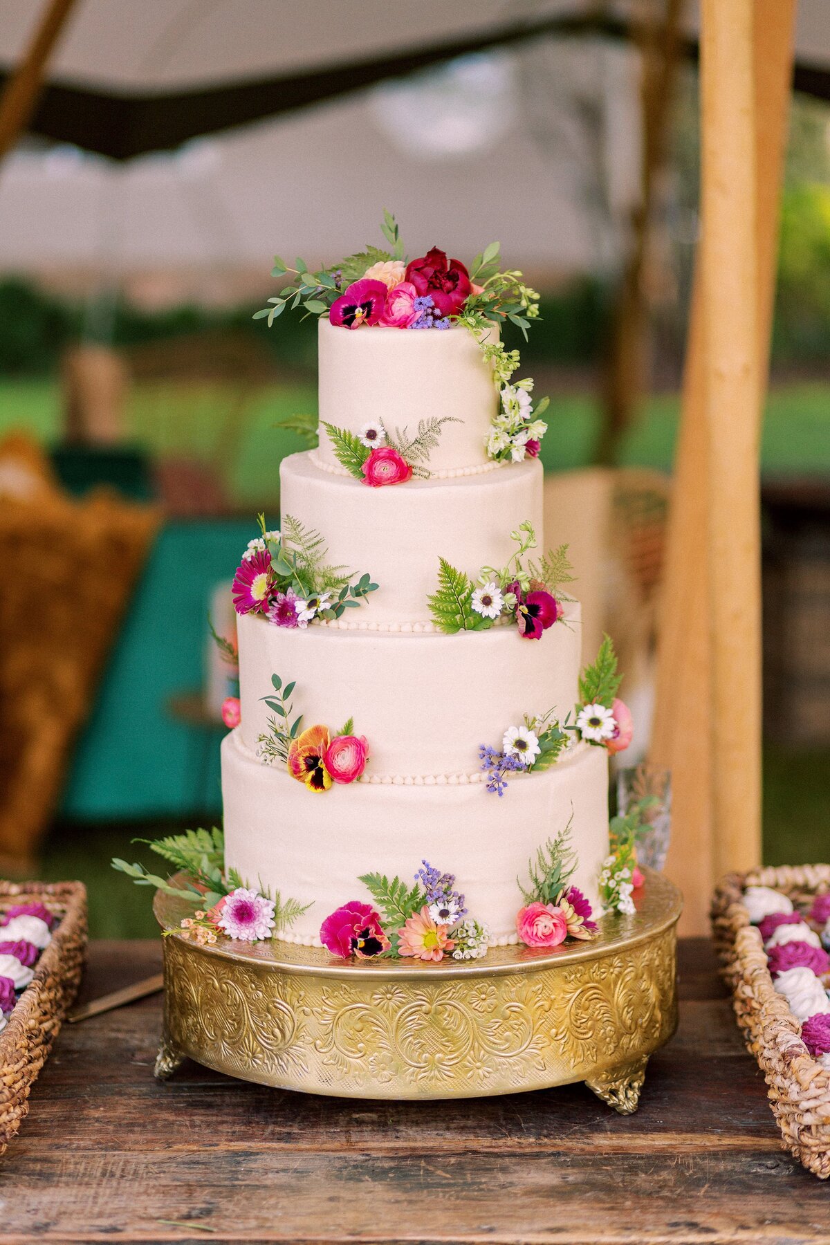 4 tiered wedding cake with flowers