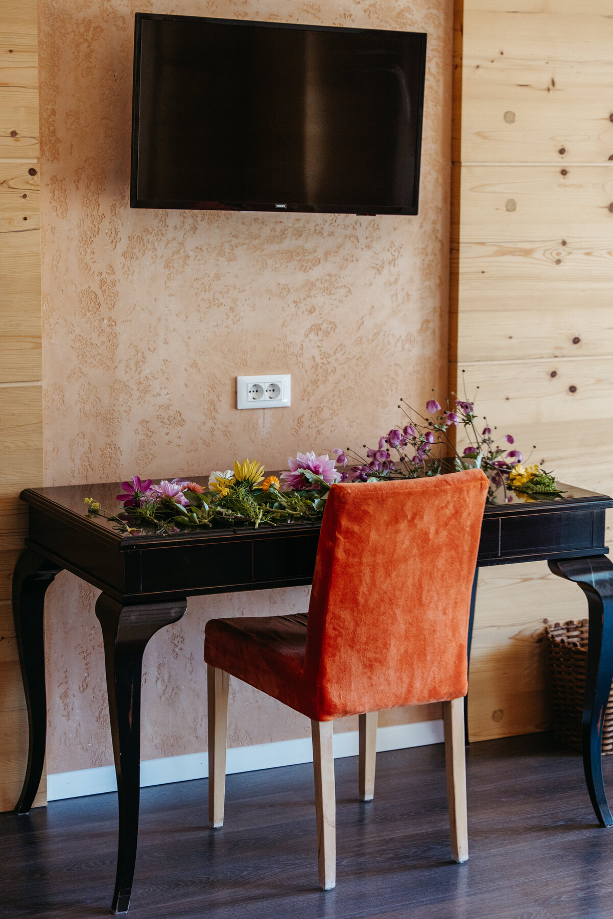 Freshly cut flowers and herbs on wooden table