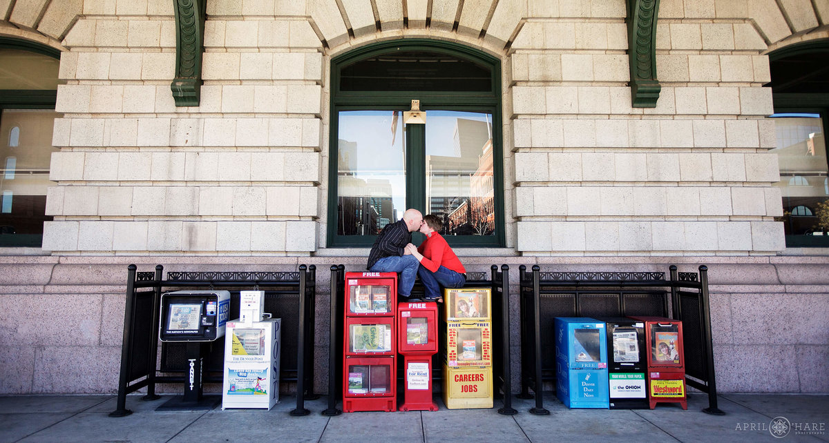 Old school Denver engagement photography on Newspaper dispensers at Union Station