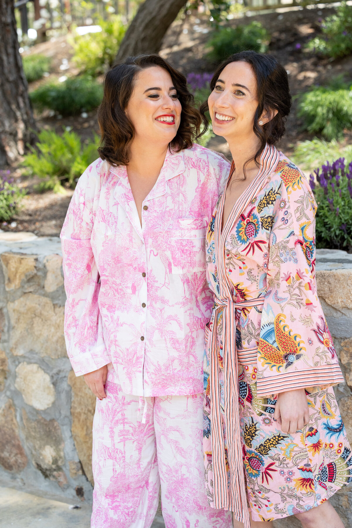 Two women smiling and standing together