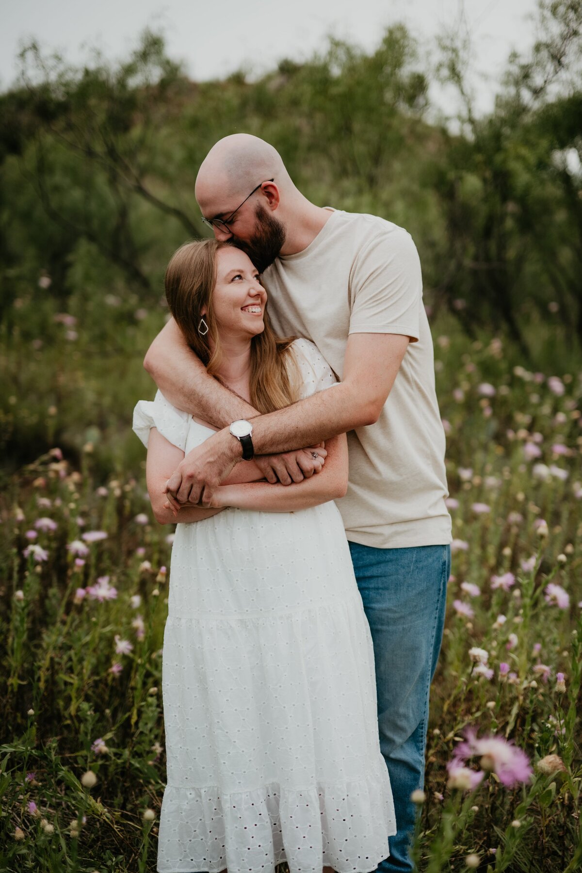 couple in flower field in palo duro canyon, texas portrait photography