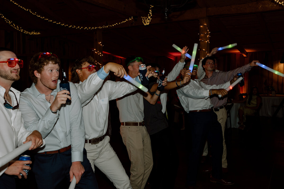 Guests wave their glowsticks during reception
