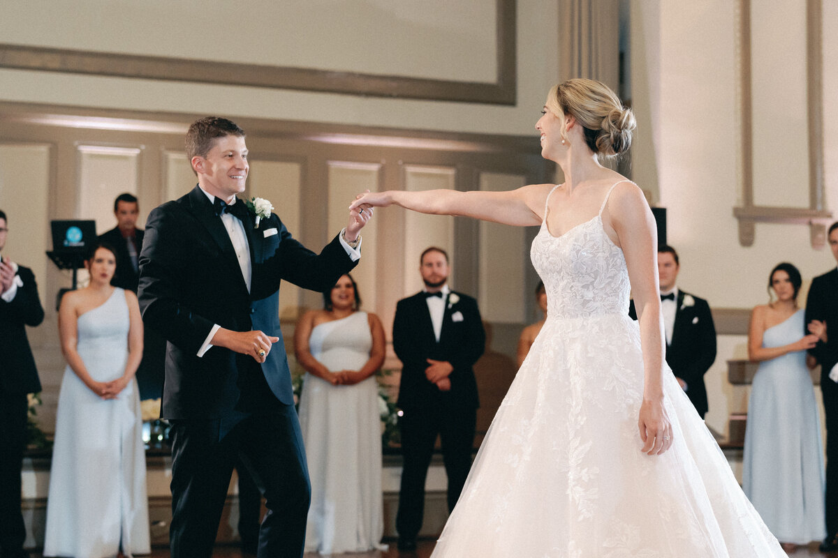 Bride and groom share first dance in Hotel John Marshall Ballroom