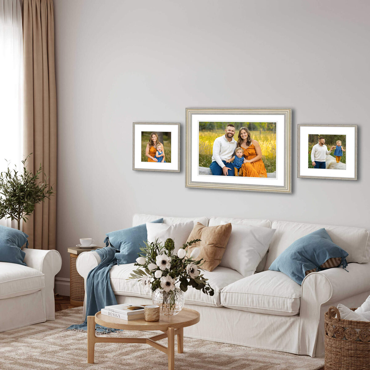 series of three framed pictures of a family hanging on a wall above a white living room couch