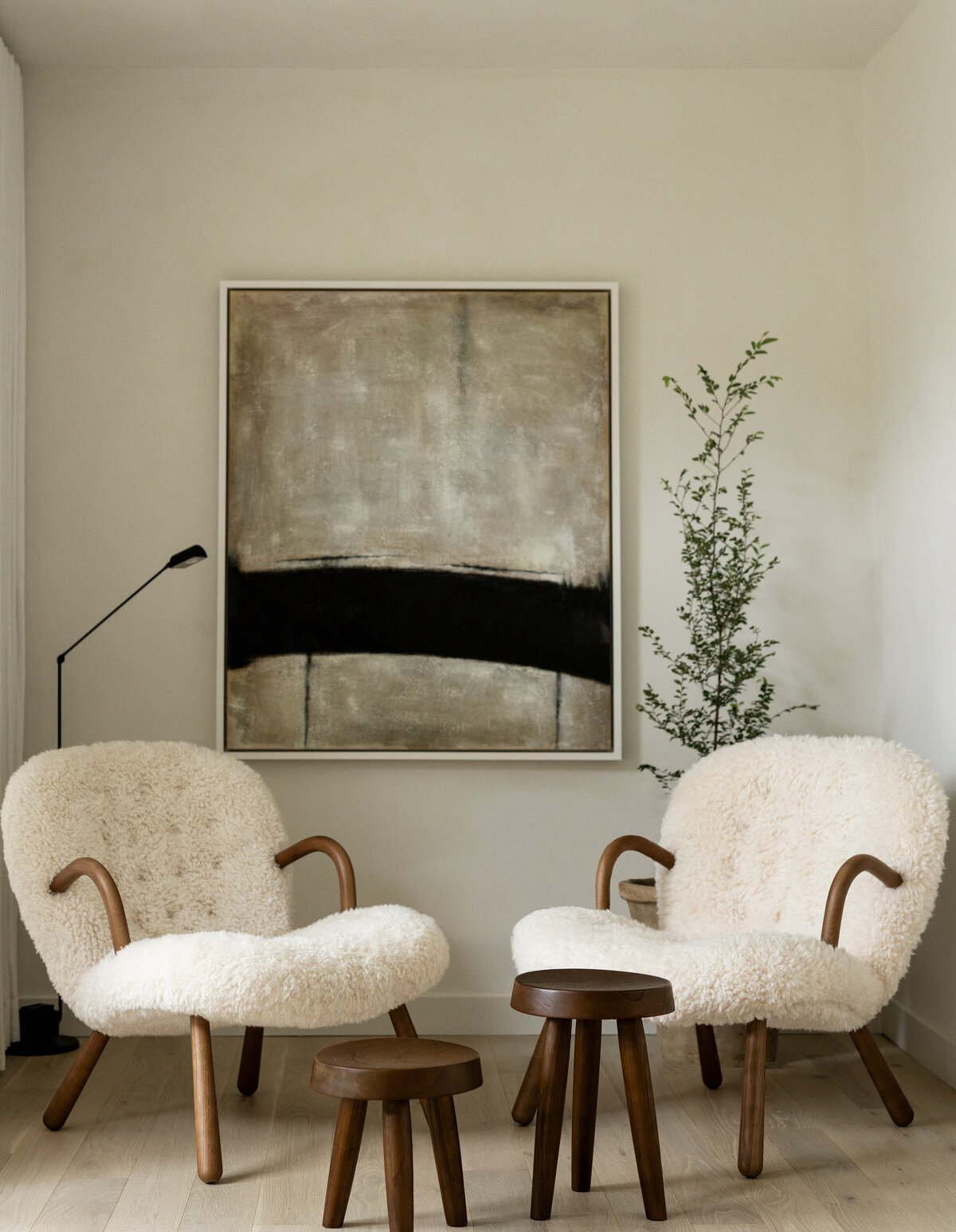 house-franc-casita-cottage-guest-house-bedroom-limewash-cozy-moody-seating-milk-stools-abstract-art-linen-curtains-oak-flooring-arnold-madsen-clam-chair-austin-texas-westlake