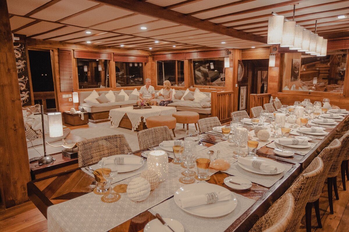 Elevate your senses as you indulge in gourmet cuisine and fine wines, curated for your pleasure on this prestigious yacht in Indonesia.