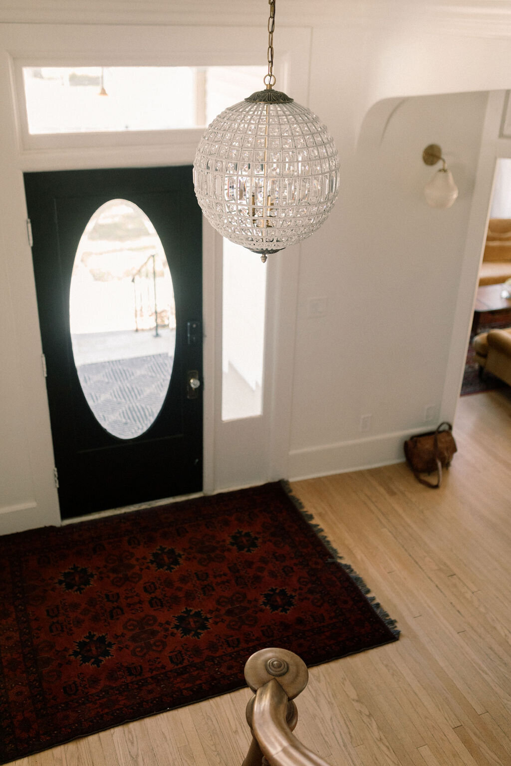 Front door, rug and hanging light in the entranceway of the Terry Guesthouse