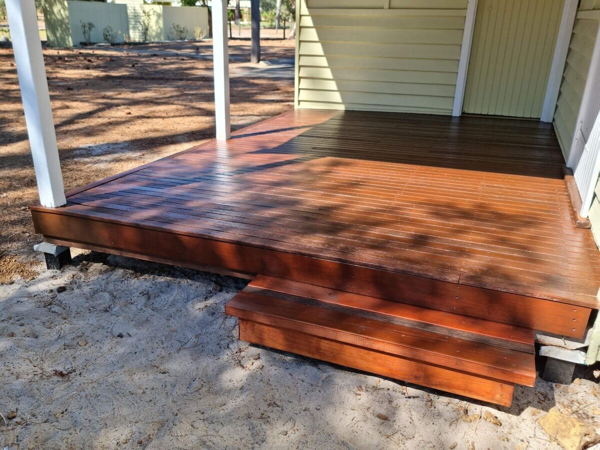 Restored outdoor timber decking with fresh stain and sealer, refreshed by New-Style Painting Service.