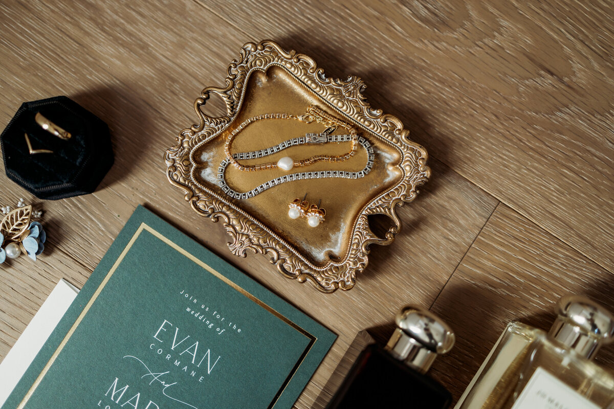 Details of bride's jewelry and invitations