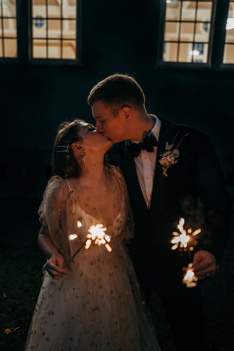 married couple with sparklers