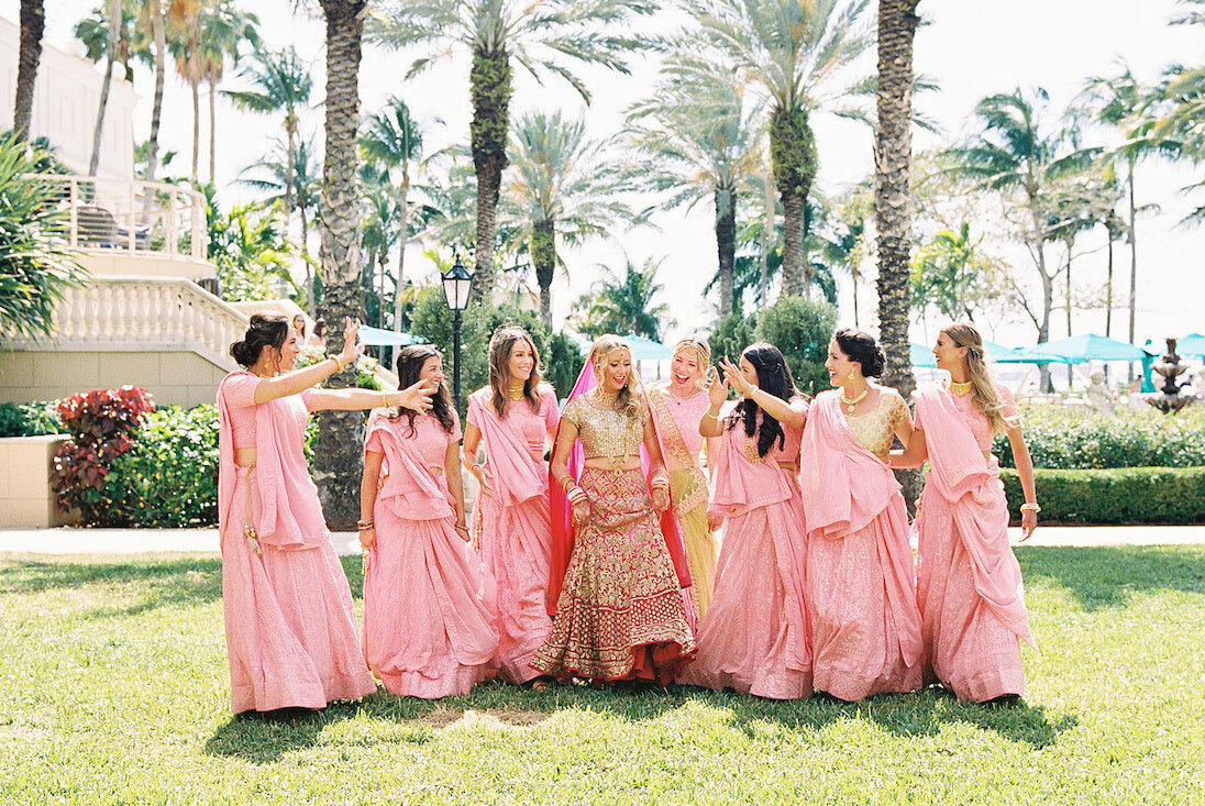 Bridesmaids wearing matching bridesmaid dresses at a destination wedding