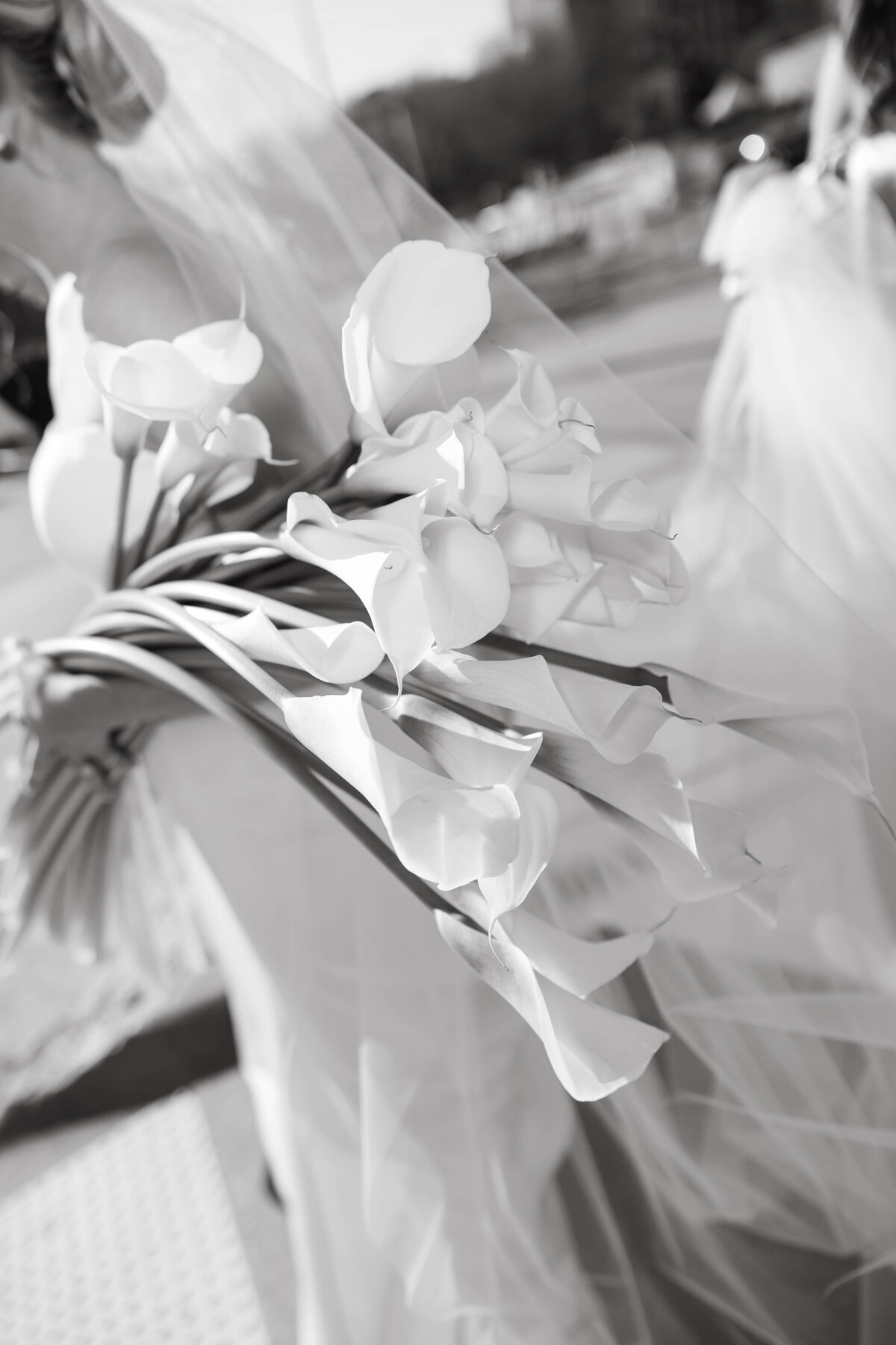 Black and white close-up of elegant calla lily bridal bouquet