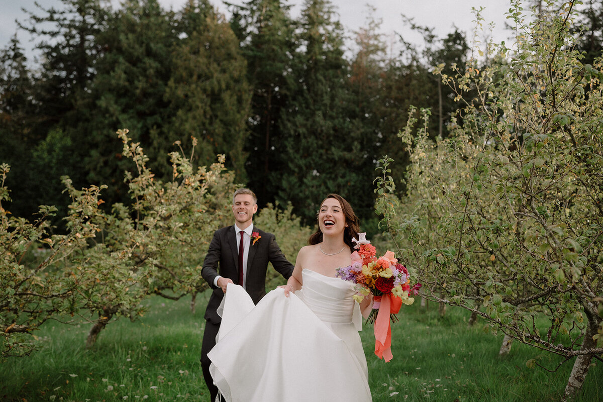 Bride and groom walking at Sea Cider wedding