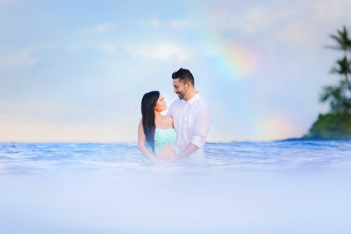 Water portrait of a couple on their Wailea babymoon photographed by Love + Water